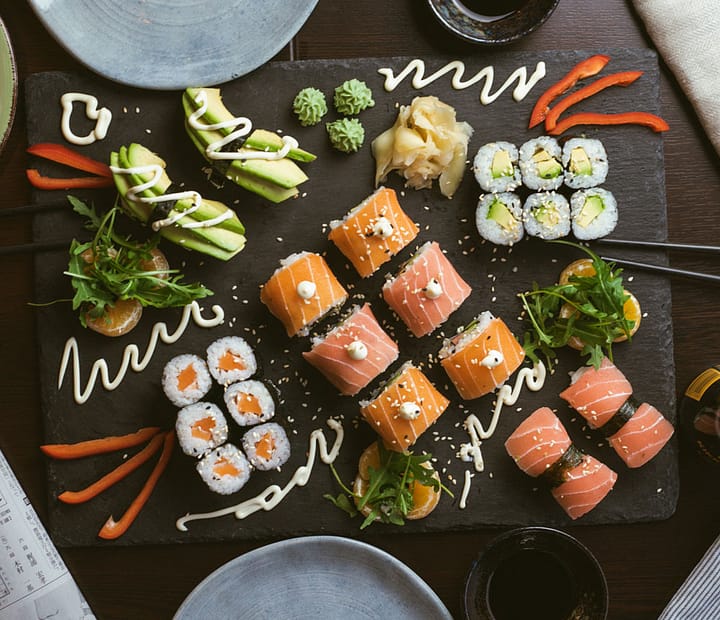 Sushi served on black tray